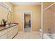 Bathroom features a sink with vanity, shower with tile walls, and toilet at 9911 Mendel Dr, New Port Richey, FL 34654