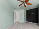 Bedroom with a ceiling fan and a black textured wall at 9911 Mendel Dr, New Port Richey, FL 34654