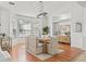 Charming dining space offers natural light, stylish light fixture, and comfortable seating for Gathering gatherings at 9911 Mendel Dr, New Port Richey, FL 34654