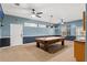 Large game room with a billiards table, kitchenette, and plenty of space for recreation at 9911 Mendel Dr, New Port Richey, FL 34654