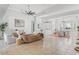 Expansive living room with tile floors, recessed lighting, and abundant natural light at 9911 Mendel Dr, New Port Richey, FL 34654