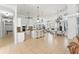 Expansive open-concept space with kitchen island, bar seating, and views of the living area at 9911 Mendel Dr, New Port Richey, FL 34654