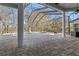Screened pool area boasts ample deck space, pillars, and beautiful outdoor views at 9911 Mendel Dr, New Port Richey, FL 34654