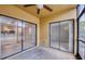 A balcony with views of the pool and multiple glass sliding doors at 10195 Sailwinds N Blvd # 101, Largo, FL 33773