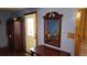 Entryway with beautiful wooden accents and an antique mirror on the wall at 1207 Pine Nw Ave, Largo, FL 33770