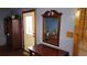 Entryway with decorative mirror, wooden accents, and natural light at 1207 Pine Nw Ave, Largo, FL 33770