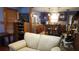 Open kitchen and living area boasts wood cabinets, stainless appliances, and bar stool seating at 1207 Pine Nw Ave, Largo, FL 33770