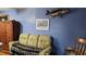 Living room featuring sailboat decor, wooden furniture, and a comfortable sofa at 1207 Pine Nw Ave, Largo, FL 33770