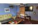 Comfortable living room features a decorative fish and sailboat painting on the wall at 1207 Pine Nw Ave, Largo, FL 33770