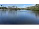 Scenic view of a pond with a fountain and lush surrounding greenery at 121 Loblolly Ct # H, Oldsmar, FL 34677