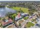 Aerial view of a home with a large lot, near a playground, and on the water at 1230 75Th N Ave, St Petersburg, FL 33702