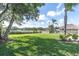 Spacious back yard with views of the lake providing a serene and picturesque setting at 1230 75Th N Ave, St Petersburg, FL 33702