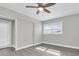 Bright bedroom features a large window with plenty of natural light and a ceiling fan at 1230 75Th N Ave, St Petersburg, FL 33702