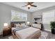 Bright bedroom with natural light from two windows, complemented by modern decor at 1230 75Th N Ave, St Petersburg, FL 33702