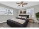 Cozy bedroom with gray walls, a ceiling fan, and luxury vinyl plank flooring at 1230 75Th N Ave, St Petersburg, FL 33702