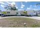 Charming single story home with a manicured lawn and circular driveway at 1230 75Th N Ave, St Petersburg, FL 33702