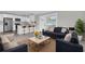 Open concept living space with a kitchen, sofa and natural light from the door at 1230 75Th N Ave, St Petersburg, FL 33702
