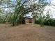 Backyard showing trees, open spaces, foliage, and playground equipment at 12950 Lincoln Rd, Riverview, FL 33578