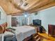 Bedroom with wooden floors, ceiling and an open closet space at 12950 Lincoln Rd, Riverview, FL 33578