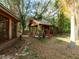 Cabin in the woods surrounded by lush trees and greenery at 12950 Lincoln Rd, Riverview, FL 33578