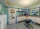 Functional walk-in closet and changing area with cabinets and shelving for optimal organization at 12950 Lincoln Rd, Riverview, FL 33578
