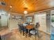 Bright dining room features an adjacent view of the kitchen and glass block wall at 12950 Lincoln Rd, Riverview, FL 33578
