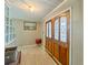 Inviting foyer with decorative double doors, tiled floors, and stylish accents, creating a warm welcome at 12950 Lincoln Rd, Riverview, FL 33578