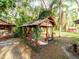 Gazebo with a red roof and a patio on a sunny day at 12950 Lincoln Rd, Riverview, FL 33578
