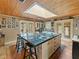 Bright kitchen features black tiled countertops, a skylight, and updated appliances and fixtures at 12950 Lincoln Rd, Riverview, FL 33578