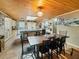 Spacious kitchen and dining area features stylish tile flooring, a wood ceiling, and ample counter space at 12950 Lincoln Rd, Riverview, FL 33578