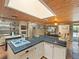 Bright kitchen features black tiled countertops, a skylight, and updated appliances and fixtures at 12950 Lincoln Rd, Riverview, FL 33578