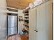 Walk-in pantry with stainless steel refrigerator and well-organized shelving at 12950 Lincoln Rd, Riverview, FL 33578
