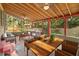 Relaxing sunroom with wood ceilings, plenty of seating, and natural lighting at 12950 Lincoln Rd, Riverview, FL 33578
