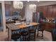 The gorgeous kitchen features an eat-in island, stainless steel appliances, and modern light fixtures at 13515 Palmera Vista Dr, Riverview, FL 33579