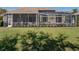 Backyard view of the screened-in pool, outdoor seating, and landscaped lawn at 13854 Thoroughbred Dr, Dade City, FL 33525