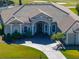A close up aerial view of a house that shows off the lush, mature landscaping at 13854 Thoroughbred Dr, Dade City, FL 33525