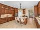 Well-appointed kitchen with an island, barstools, and ample cabinet space at 13854 Thoroughbred Dr, Dade City, FL 33525
