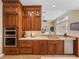 Custom kitchen featuring a breakfast bar, stainless appliances and modern finishes at 13854 Thoroughbred Dr, Dade City, FL 33525