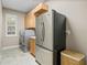 Laundry room with stainless-steel appliances and tile floor at 13854 Thoroughbred Dr, Dade City, FL 33525