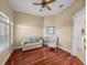 Relaxing sitting room with hardwood floors, ample natural light, and comfortable seating arrangements at 13854 Thoroughbred Dr, Dade City, FL 33525