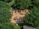 Aerial shot of the community playground surrounded by mature trees at 13854 Thoroughbred Dr, Dade City, FL 33525