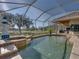 Beautiful pool area with golf course view and an outdoor seating area at 13854 Thoroughbred Dr, Dade City, FL 33525