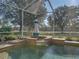 Close-up of decorative lighthouse water feature next to the pool at 13854 Thoroughbred Dr, Dade City, FL 33525