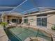Inviting pool area offering a perfect blend of indoor-outdoor living and leisure at 13854 Thoroughbred Dr, Dade City, FL 33525