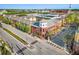 Aerial view of vibrant commercial building with mixed-use space, surrounded by lush landscaping at 1910 E Palm Ave # 10301, Tampa, FL 33605