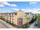 Stunning exterior view of a colorful condominium complex with unique architectural details and landscaping at 1910 E Palm Ave # 10301, Tampa, FL 33605