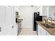 Modern kitchen features stainless steel appliances and tile floors at 1910 E Palm Ave # 10301, Tampa, FL 33605