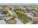 Aerial view of a neighborhood featuring mature trees, residential homes, and well-maintained streets for convenient access at 1937 Palm Dr, Clearwater, FL 33763
