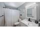 Updated bathroom featuring modern fixtures, a marble vanity, and clean decor at 1937 Palm Dr, Clearwater, FL 33763