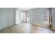 This bedroom features sleek wood-look floors, neutral walls, and plenty of natural light at 1937 Palm Dr, Clearwater, FL 33763